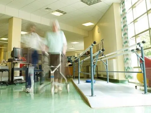 Person performing gentle back mobility exercises for spinal arthritis